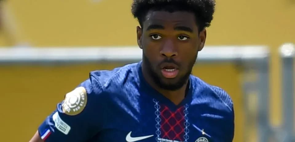 Player wearing PSG kit during a match