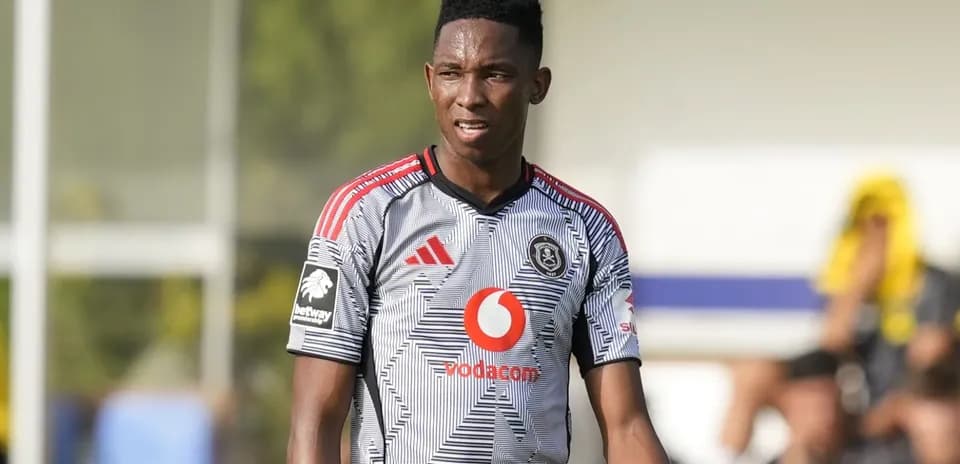 Player in Orlando Pirates jersey during match