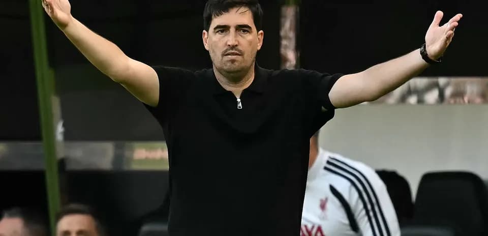 Coach gesturing during a match from the sideline