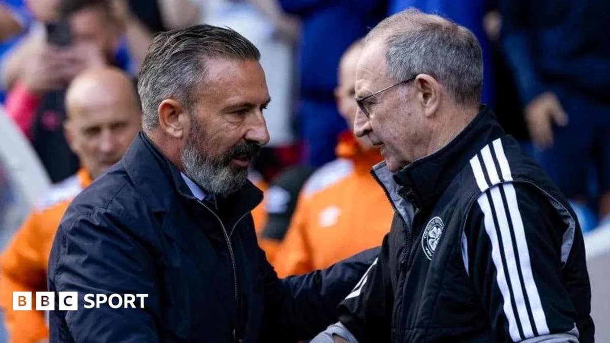 Two coaches shaking hands before a match