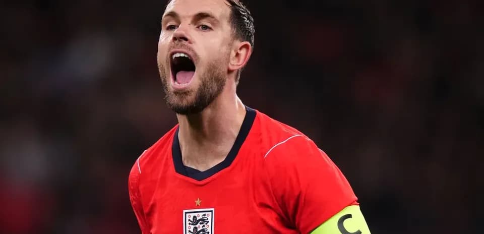 Player celebrating in England's red jersey with captain's armband