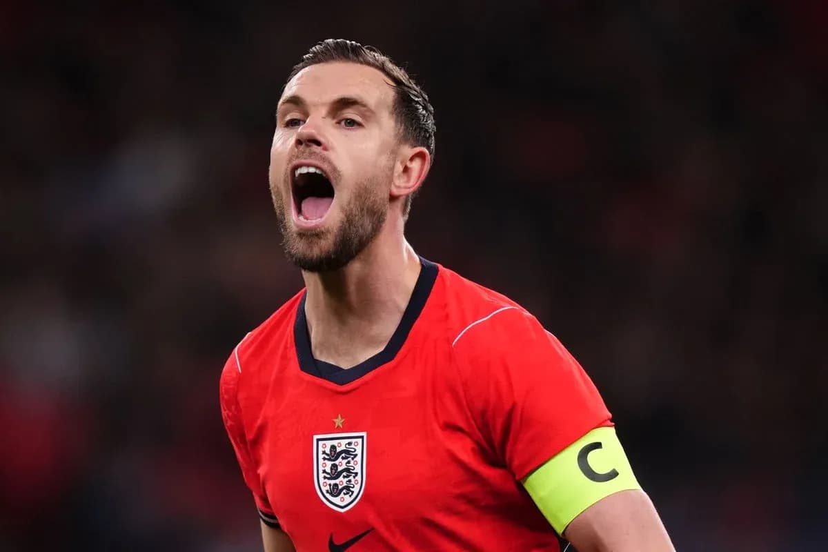 Player celebrating in England's red jersey with captain's armband