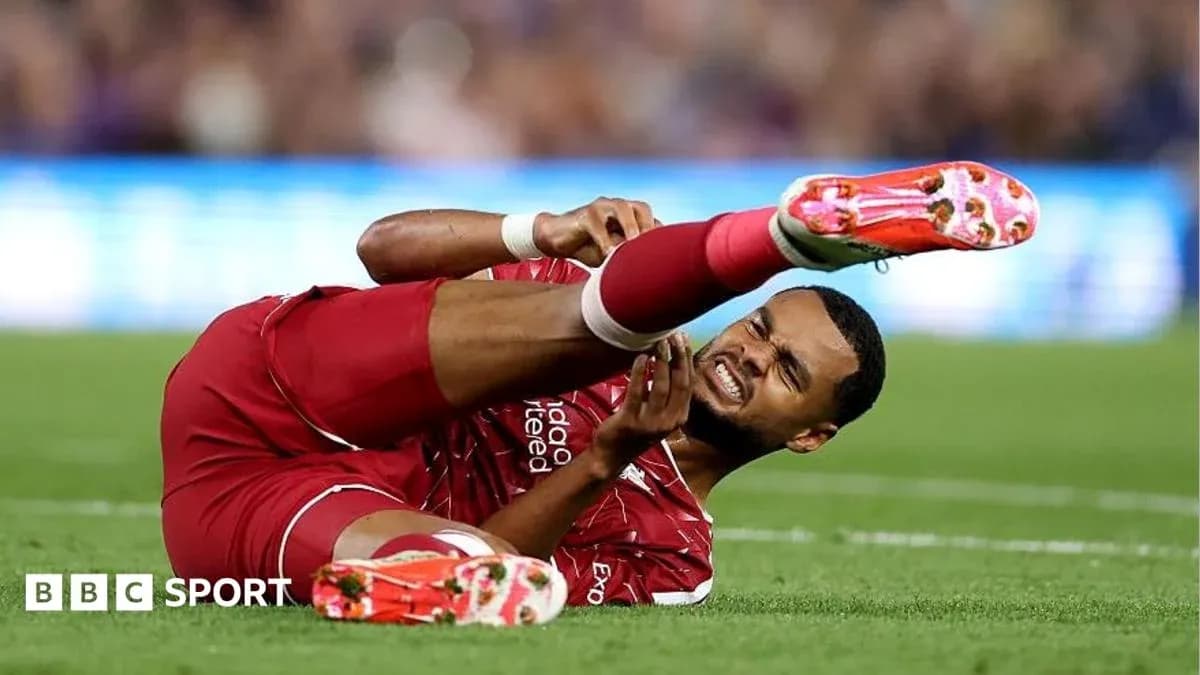 Player in red jersey injured on the ground