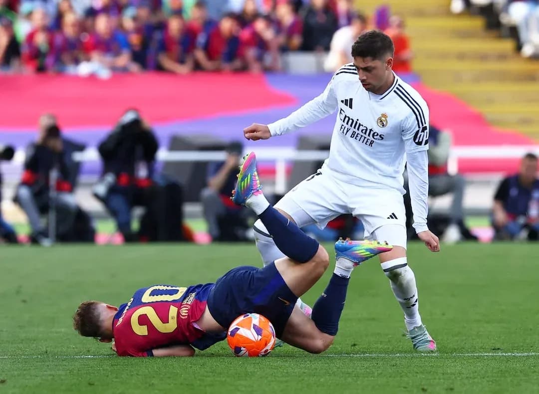 Barcelona player on the ground during match action