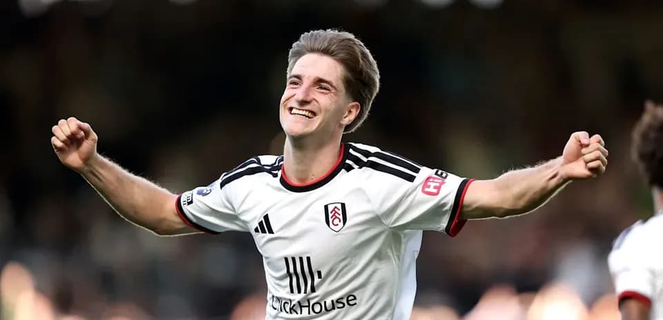 Fulham player celebrating a goal on the pitch