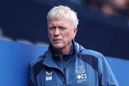 Manager standing on the sidelines during match