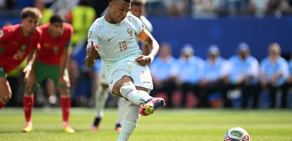 Player taking a penalty kick during a match