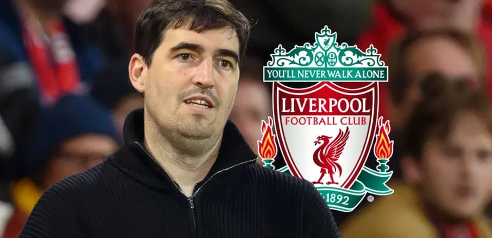 Man observing Liverpool FC logo in the background
