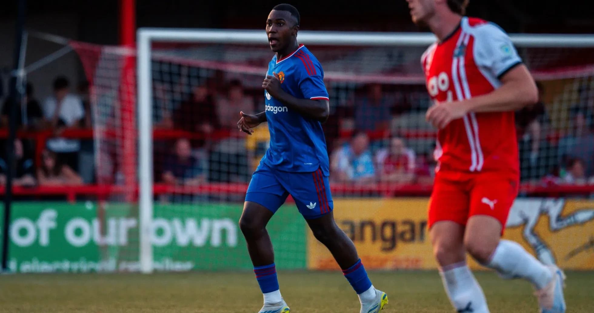 Player in blue jersey running on the field