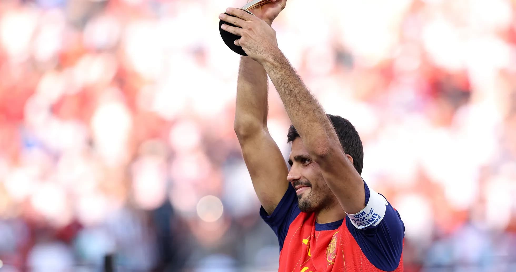 Player celebrating with trophy after match victory