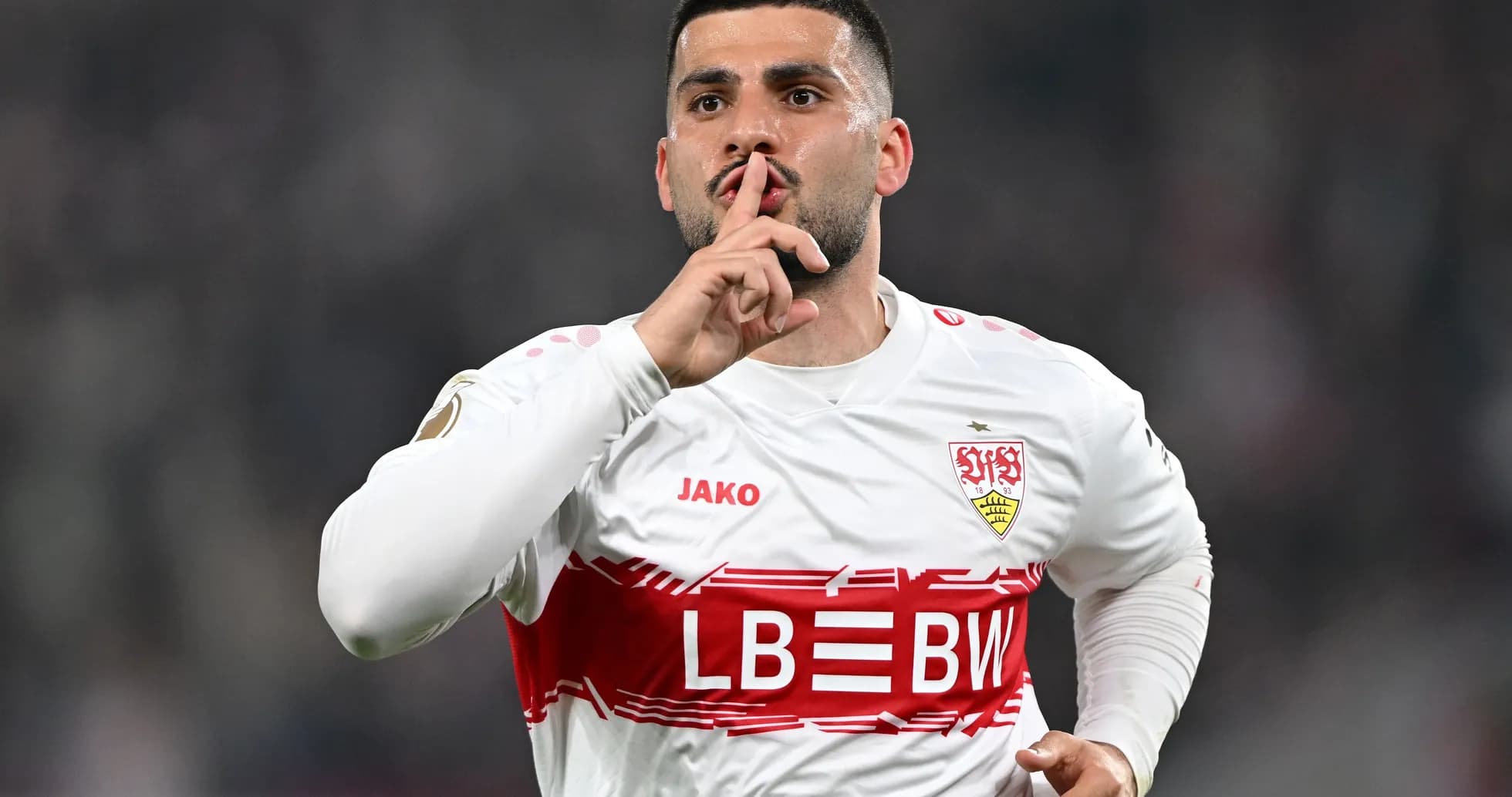 Player celebrating with finger to lips after scoring