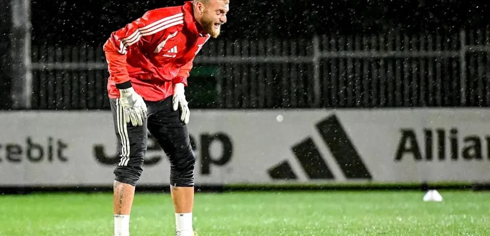 Goalkeeper training in the rain at practice