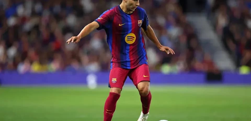 Player dribbling ball during match for Barcelona