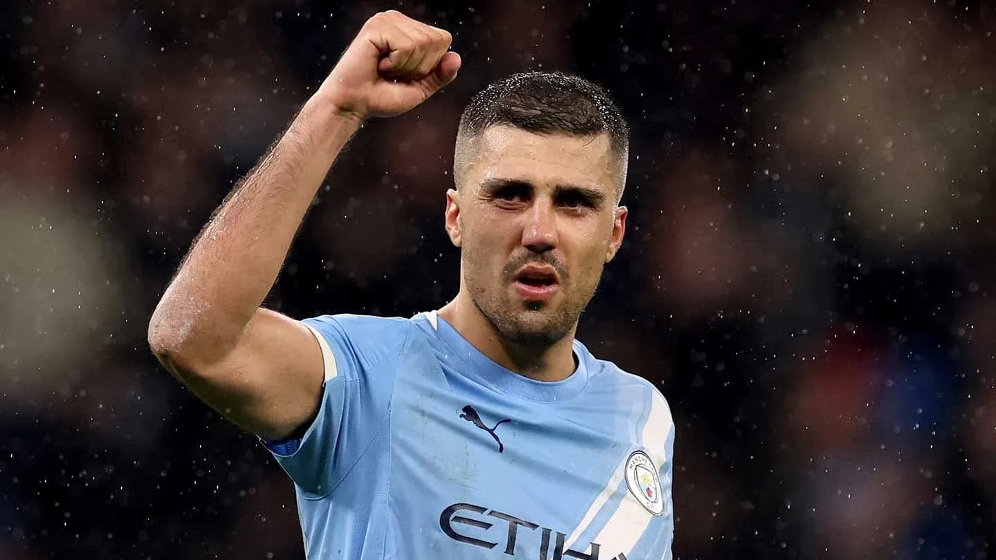 Player celebrating with raised fist in Manchester City kit