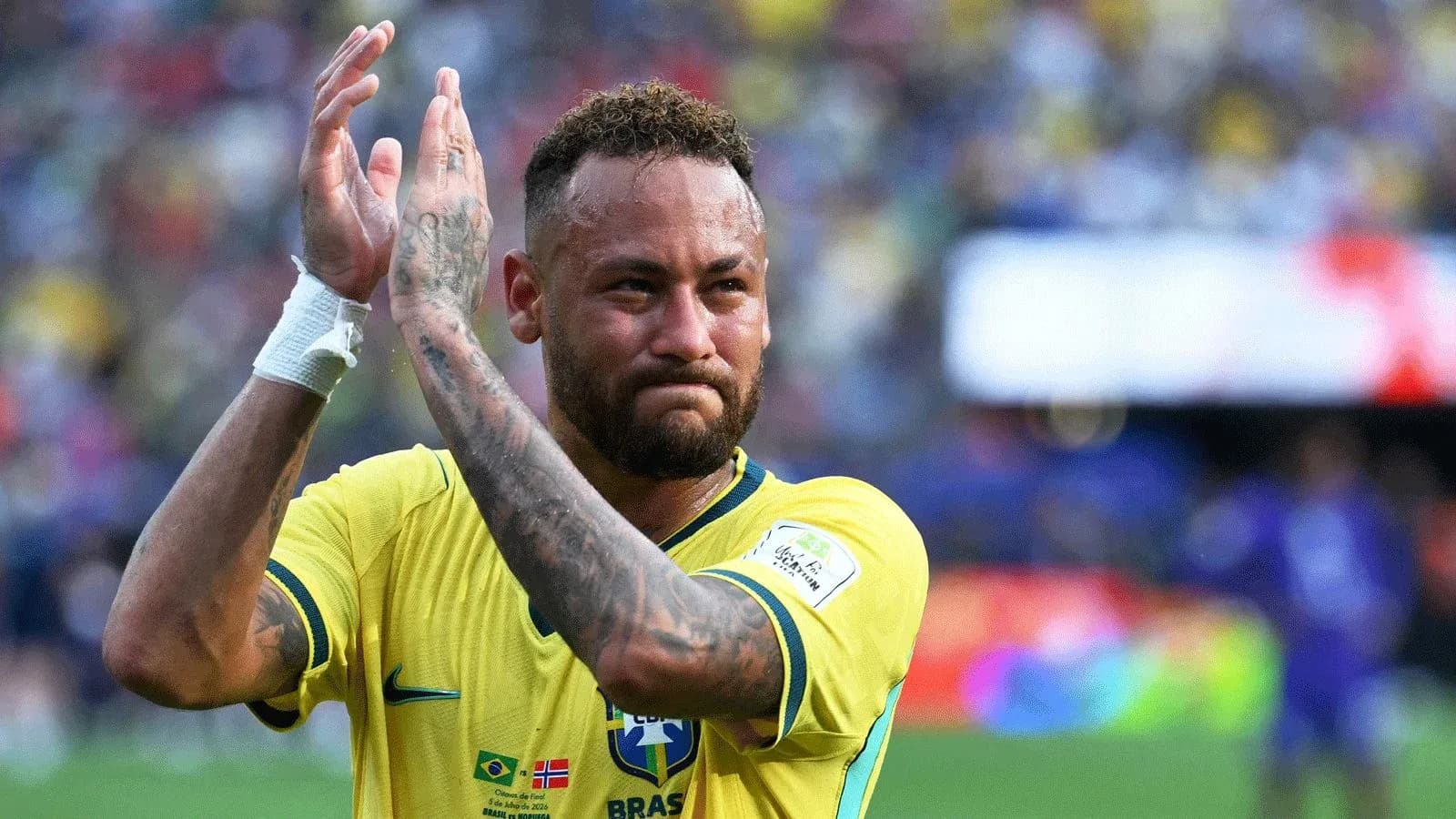 Player applauding fans during a match