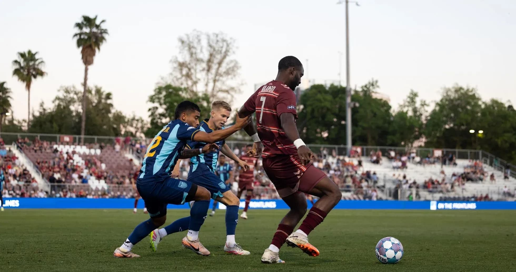 Players contesting for the ball during match