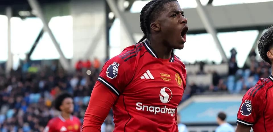 Player celebrating a goal in Manchester United kit