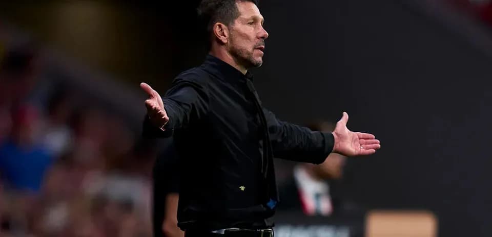 Coach gesturing from the sideline during match