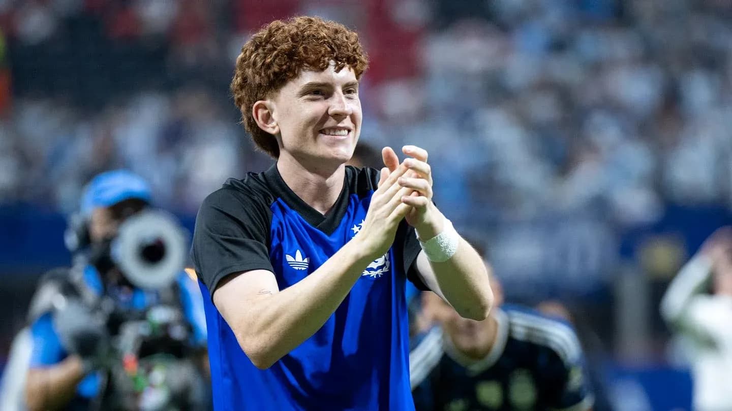 Player applauding fans after a match