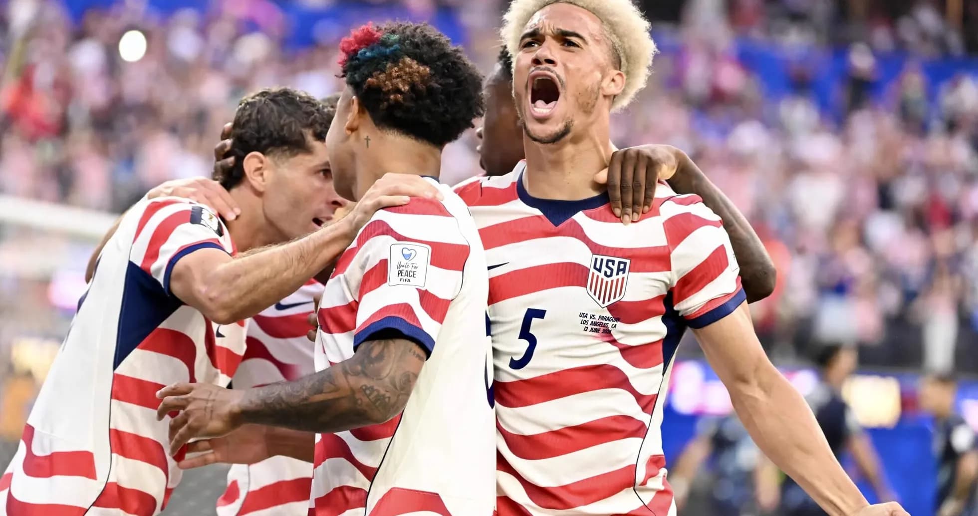 USA players celebrating a goal in World Cup match