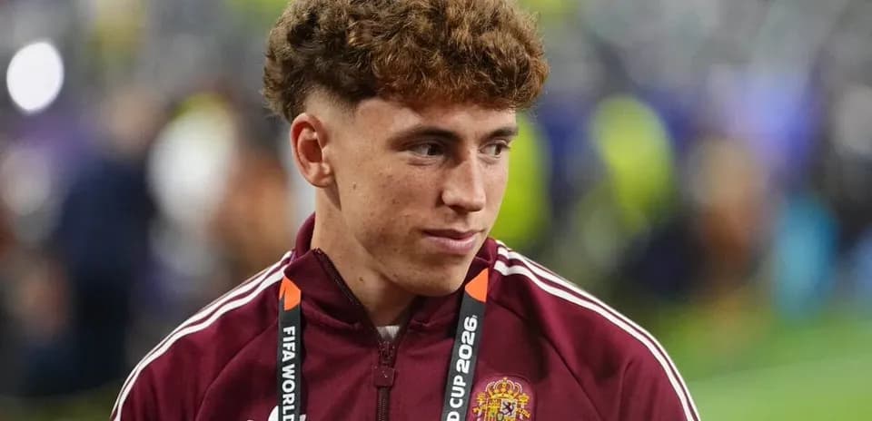 Player wearing Spain tracksuit with FIFA World Cup lanyard