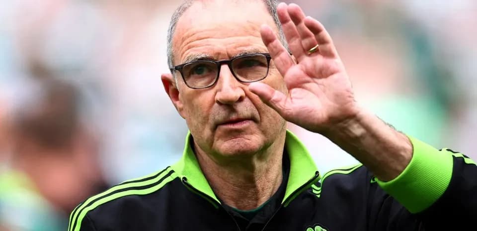 Coach waving during a match at the stadium