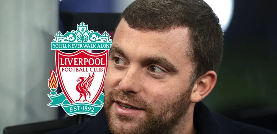 Close-up of a man with Liverpool FC logo background