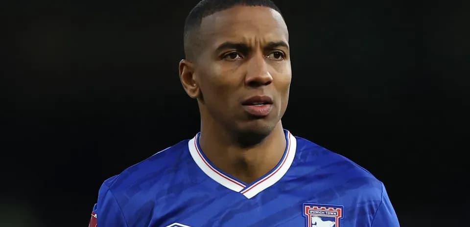 Football player in Ipswich Town jersey during match