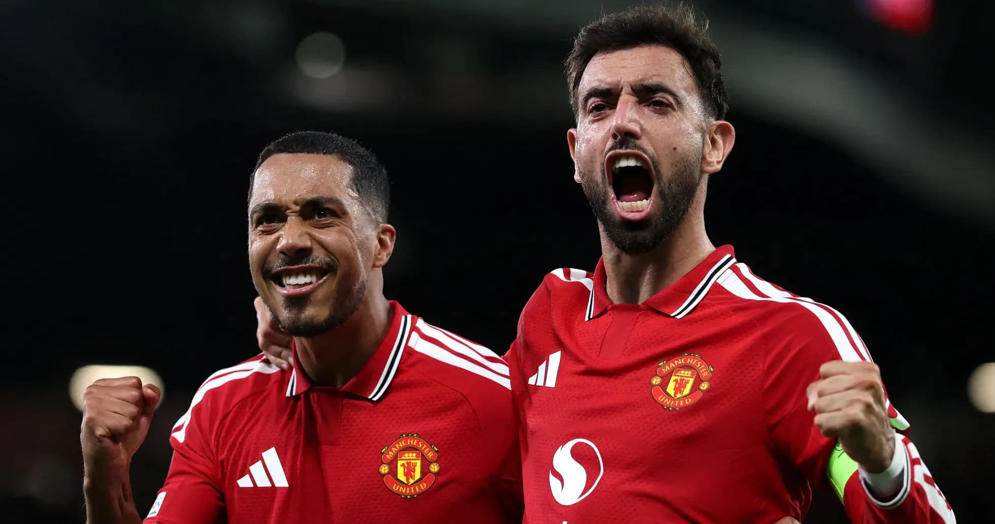 Two Manchester United players celebrating a goal