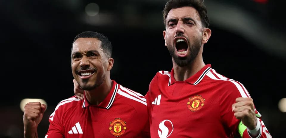 Two Manchester United players celebrating a goal