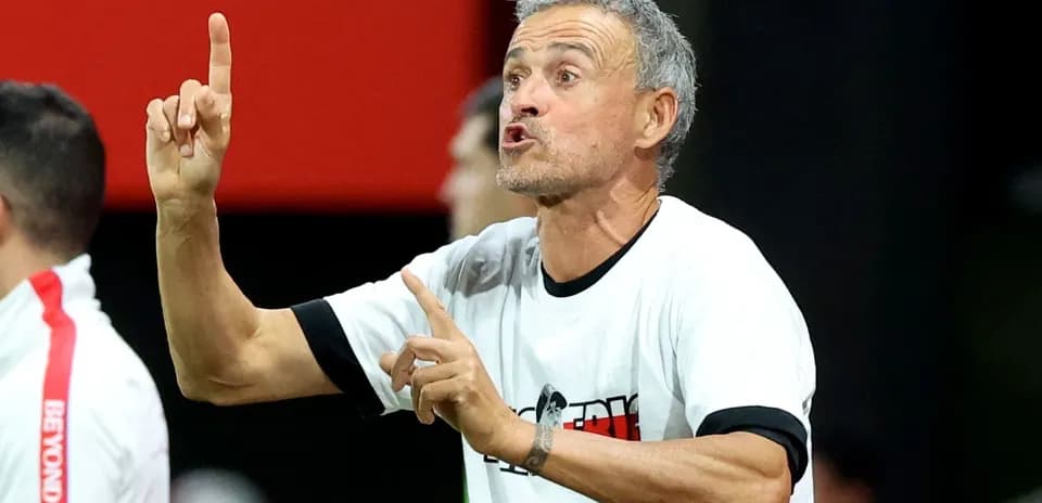 Coach giving instructions on the sideline