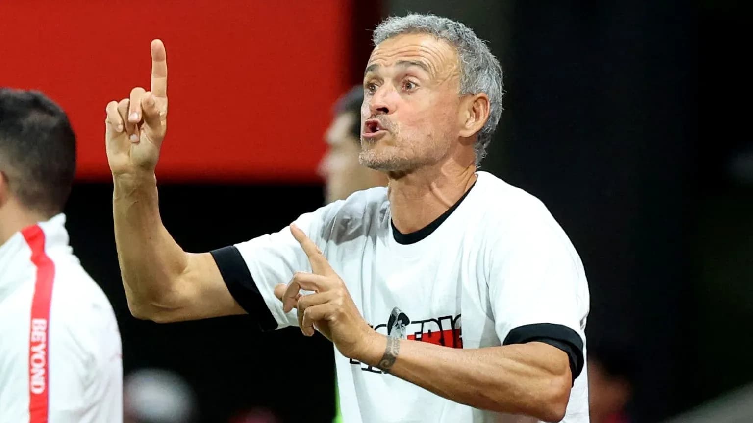 Coach giving instructions on the sideline