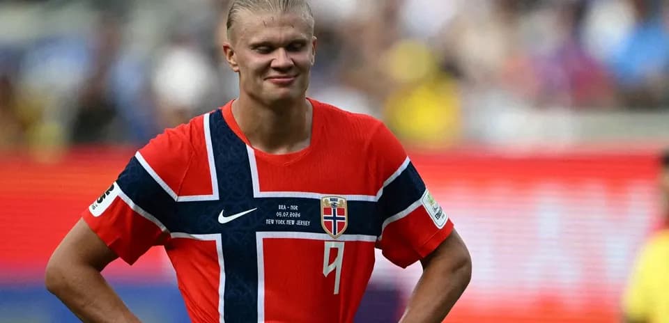Norwegian player in red jersey on the field