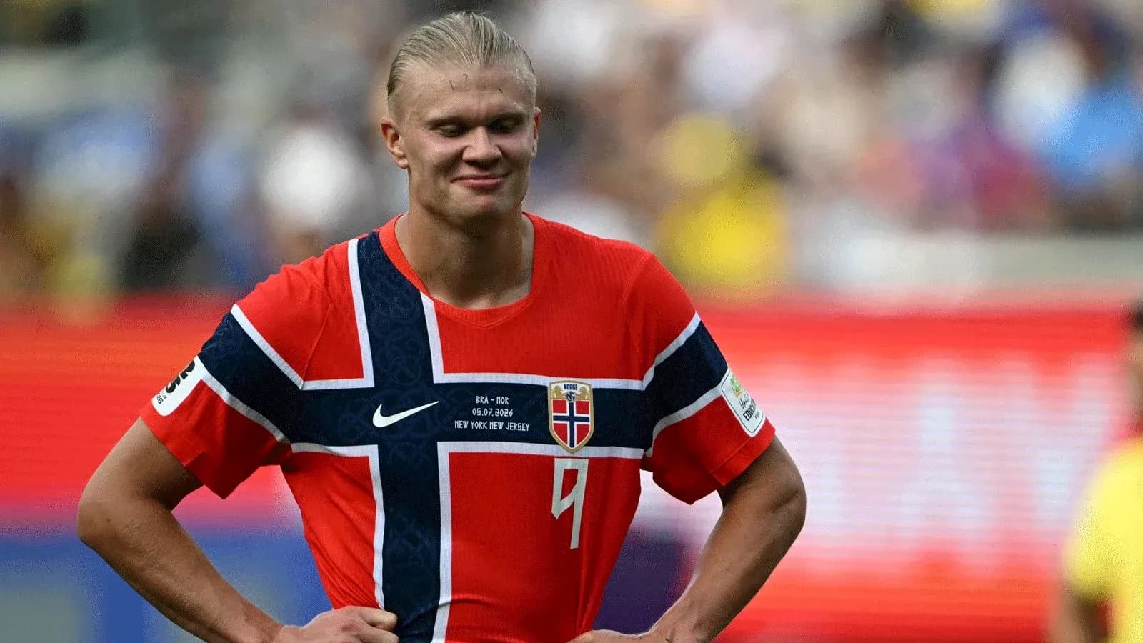Norwegian player in red jersey on the field