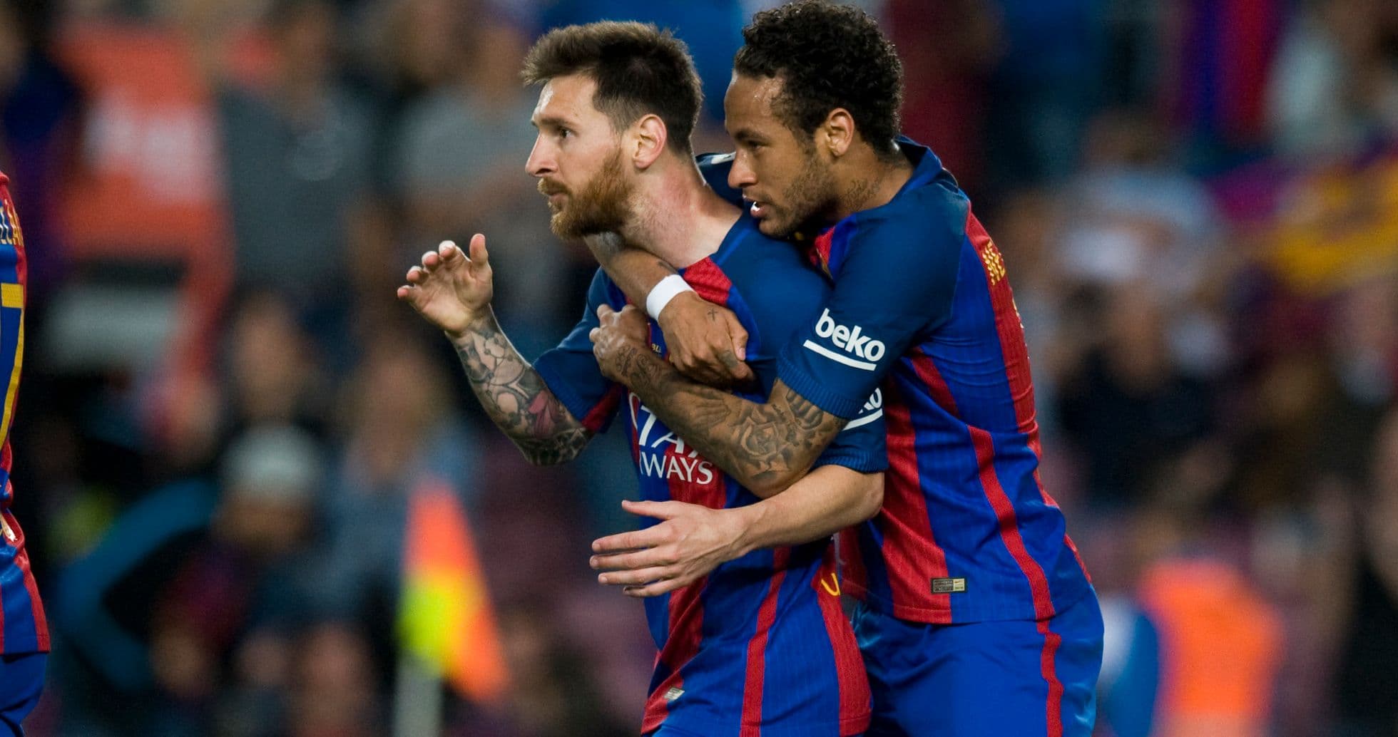 Lionel Messi celebrating with Neymar after scoring