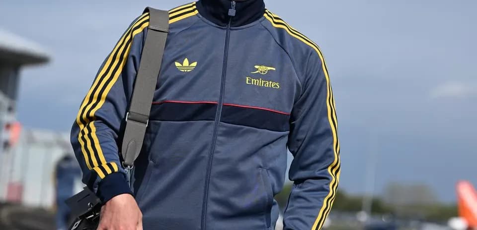 Athlete walking in sportswear with bag