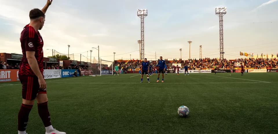 Player preparing for corner kick during match