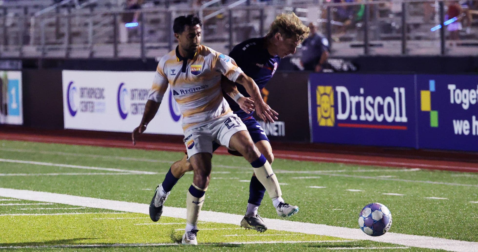 One Knoxville player competing for the ball