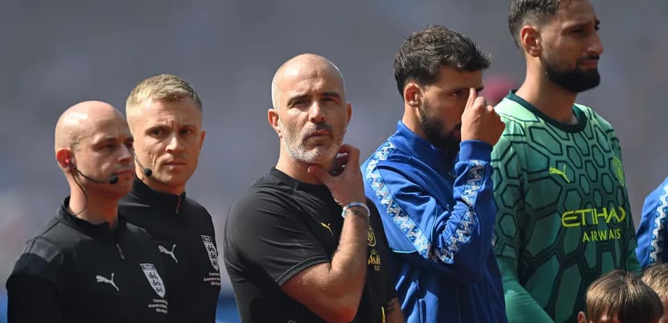 Coaches and officials lined up before the match