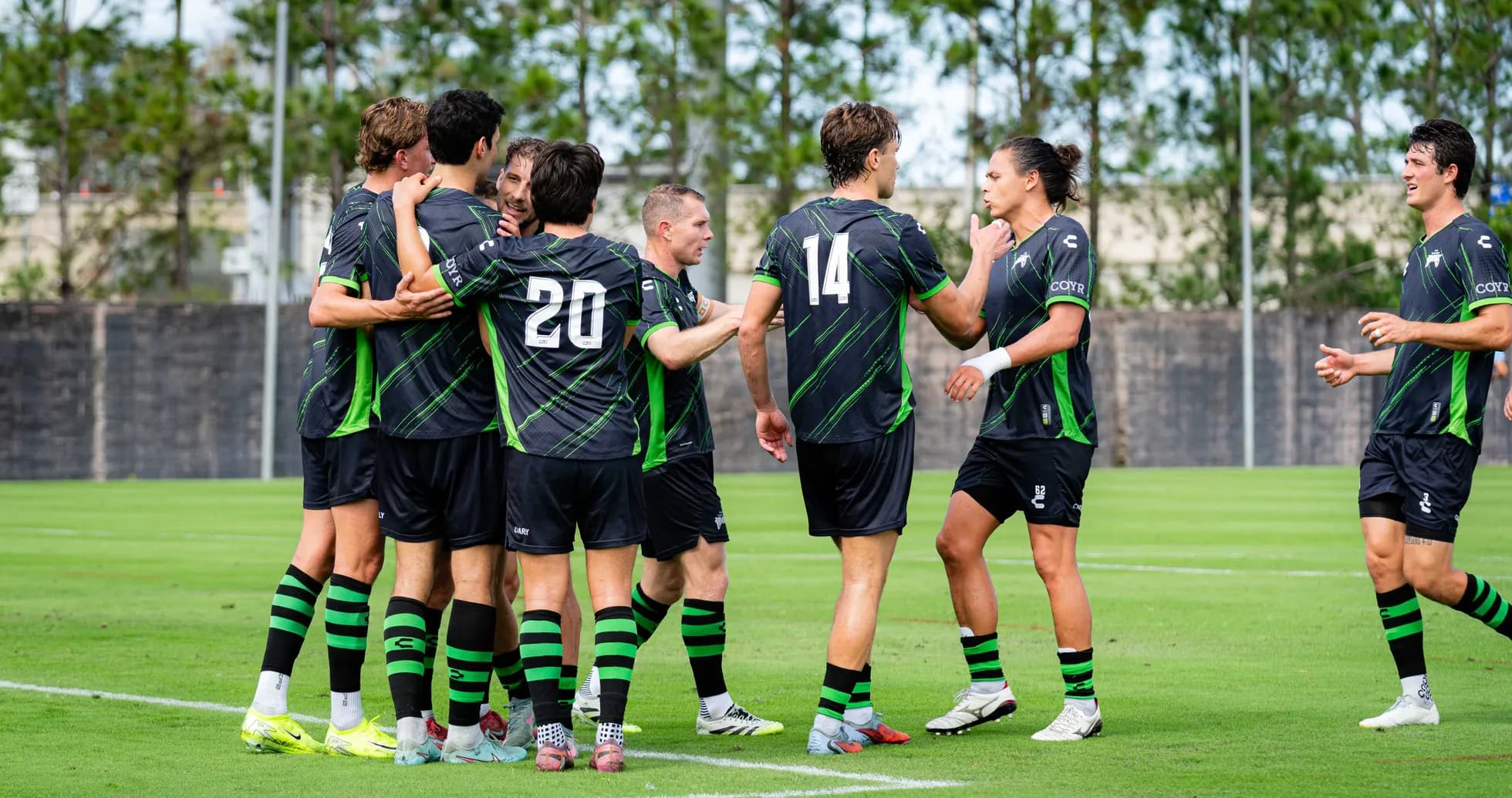 Players celebrating a goal during training session