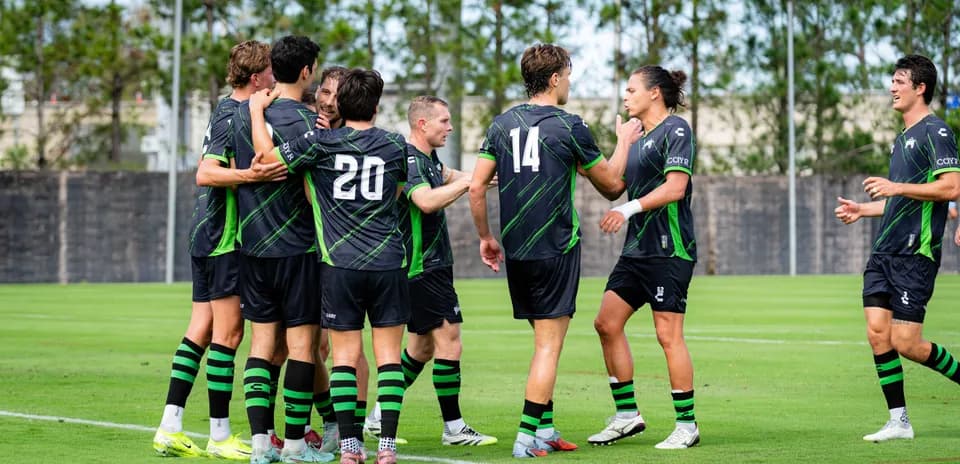 Players celebrating a goal during training session