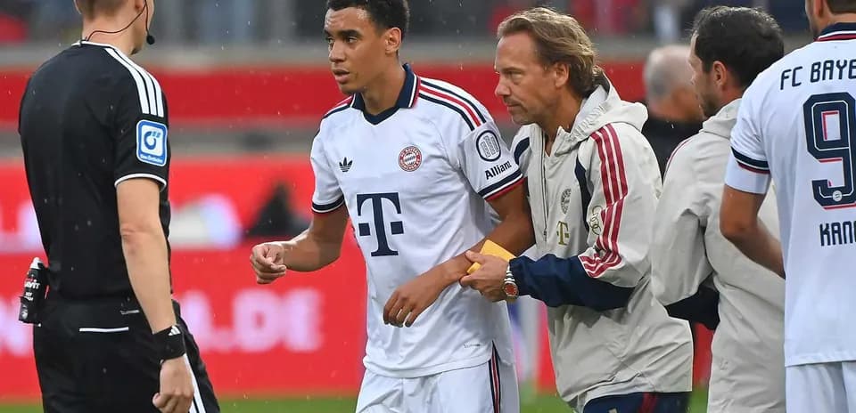 Player receiving medical attention from staff during match