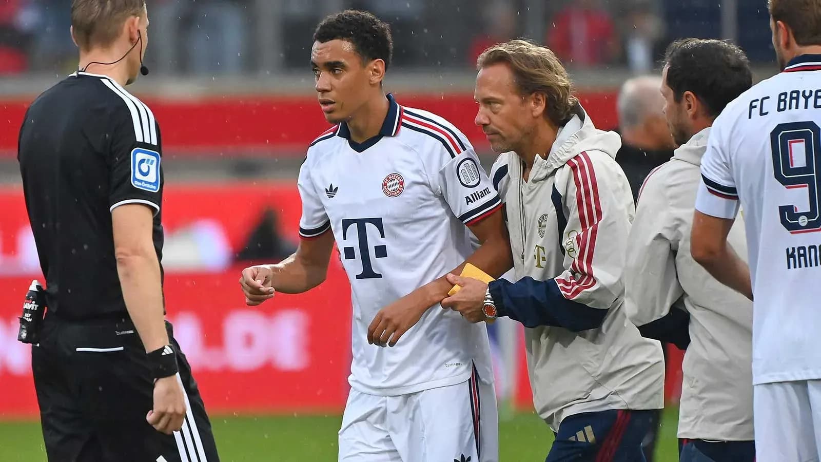 Player receiving medical attention from staff during match