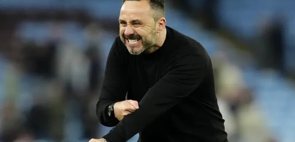 Coach celebrating passionately on the sideline