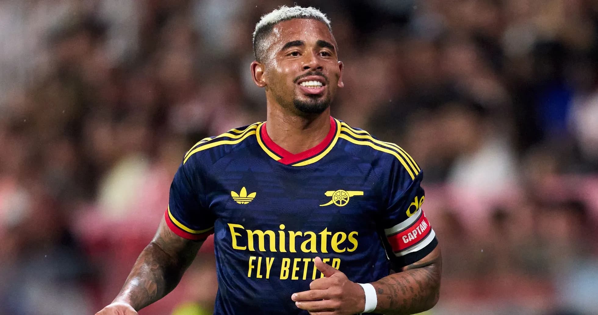 Player wearing Arsenal jersey celebrating during match