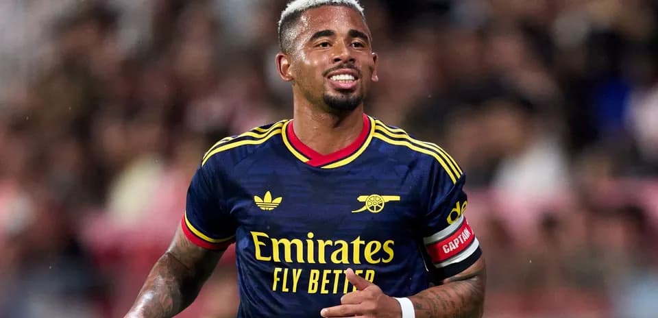 Player wearing Arsenal jersey celebrating during match
