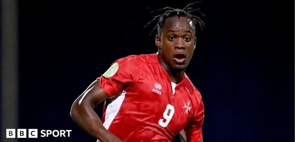 Player in red jersey during a soccer match