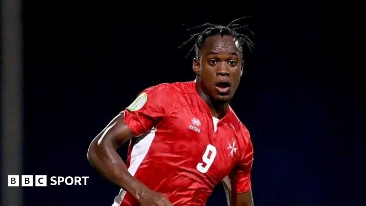Player in red jersey during a soccer match