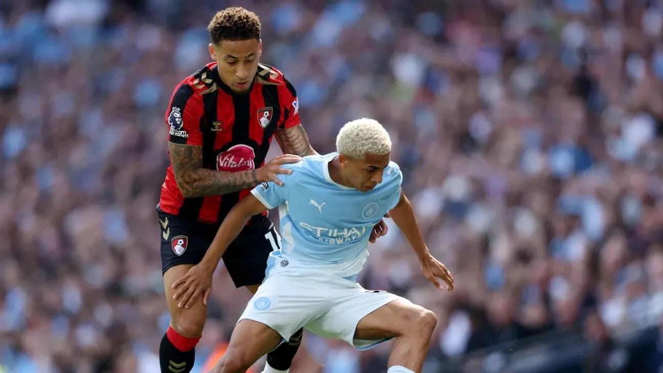 Player from Bournemouth tackling Manchester City player