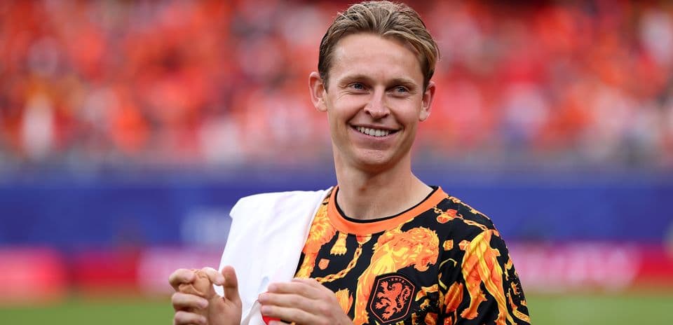 Player in vibrant shirt smiling during warm-up